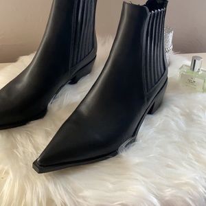 Pointed black boots
